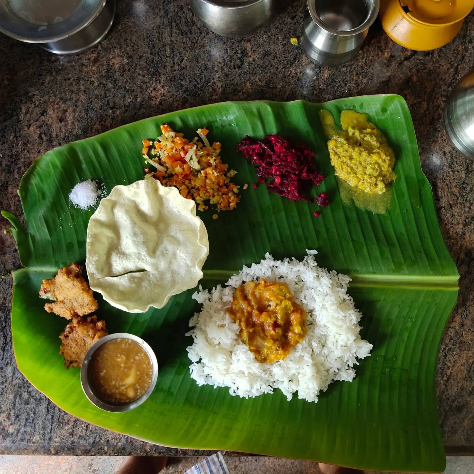 A traditional South Indian meal served on a banana leaf
