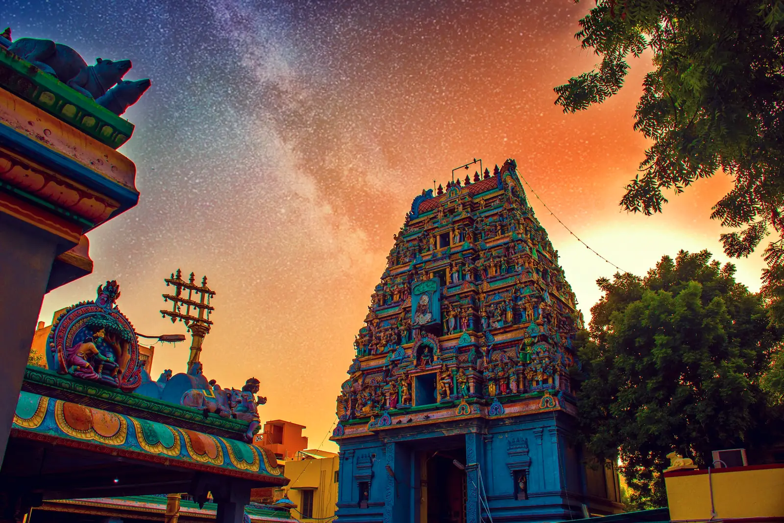 A painted temple gopuram in Chennai under a starry night sky
